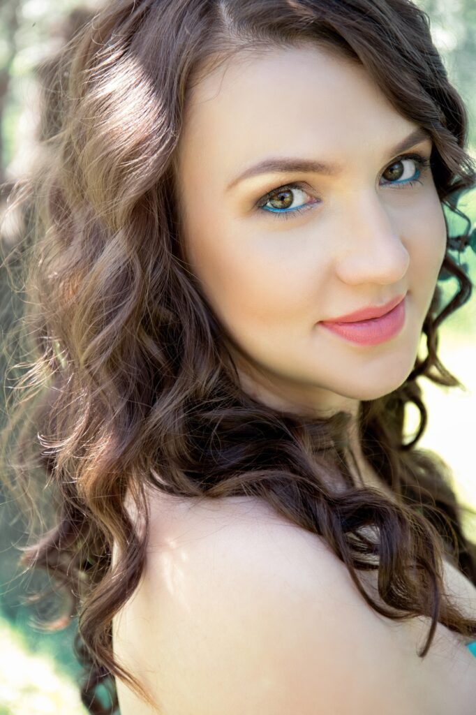 Portrait of a beautiful brown-eyed girl in nature