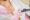 Specialist conducts session of laser breast hair removal for young client