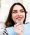 Girl chooses color of veneers at the dentist office